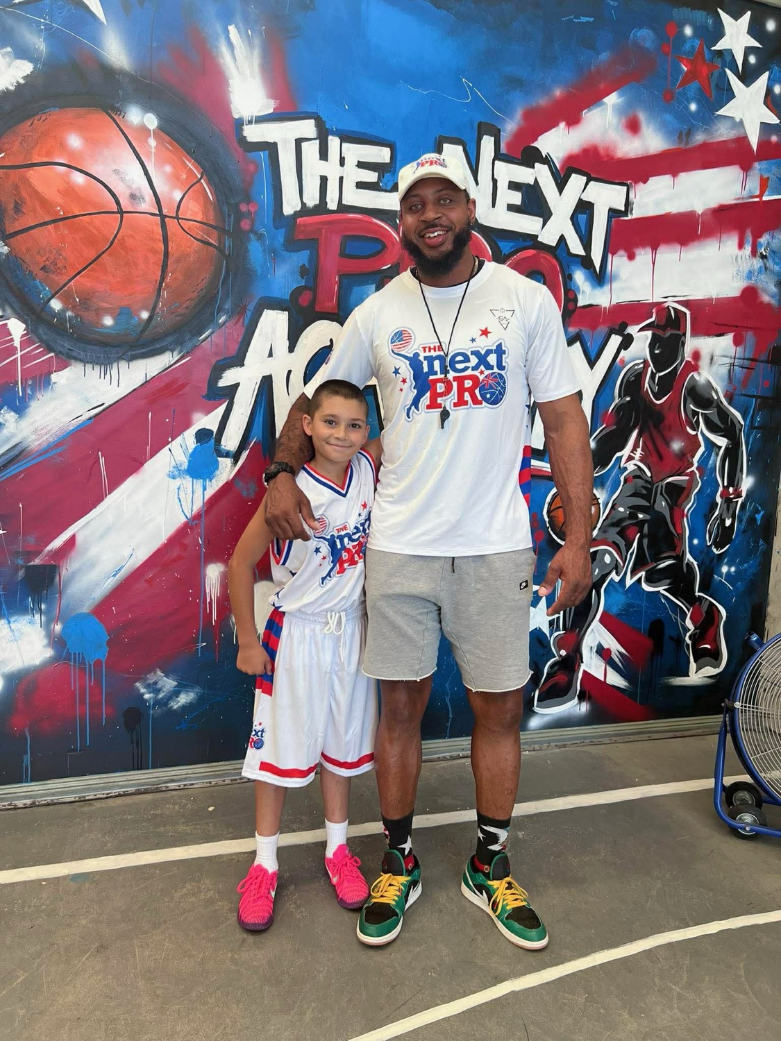 Coach Ivan Harris with a young player